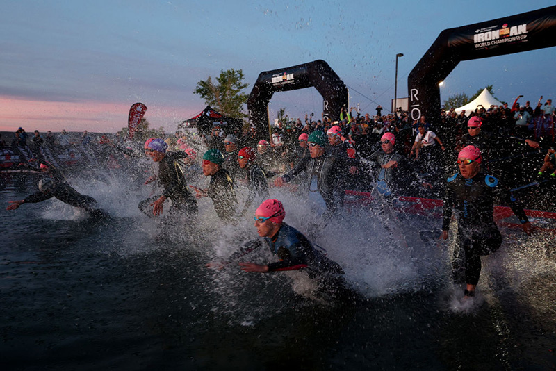 Athletes make their way into the water for the women's pro swim start during the IRONMAN World Championships. (Photo by Tom Pennington/Getty Images for IRONMAN)