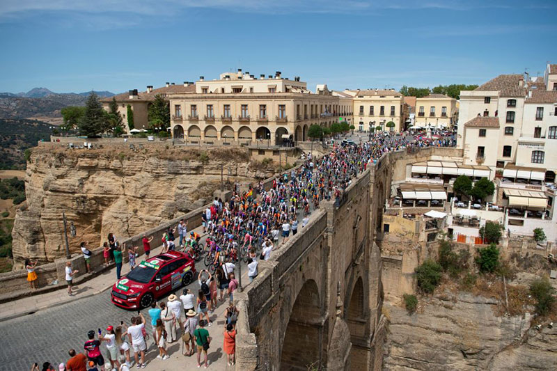 Riders cross the New Bridge in Ronda during the 13th stage of the 2022 La Vuelta cycling tour of Spain, a 168.4 km from Ronda to Montilla, in Ronda, southern Spain, on September 2, 2022. (Photo by JORGE GUERRERO / AFP) (Photo by JORGE GUERRERO/AFP via Getty Images)